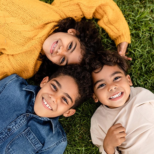 Kids lying on grass