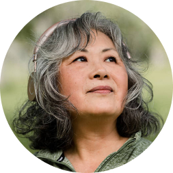 Asian senior woman looking up