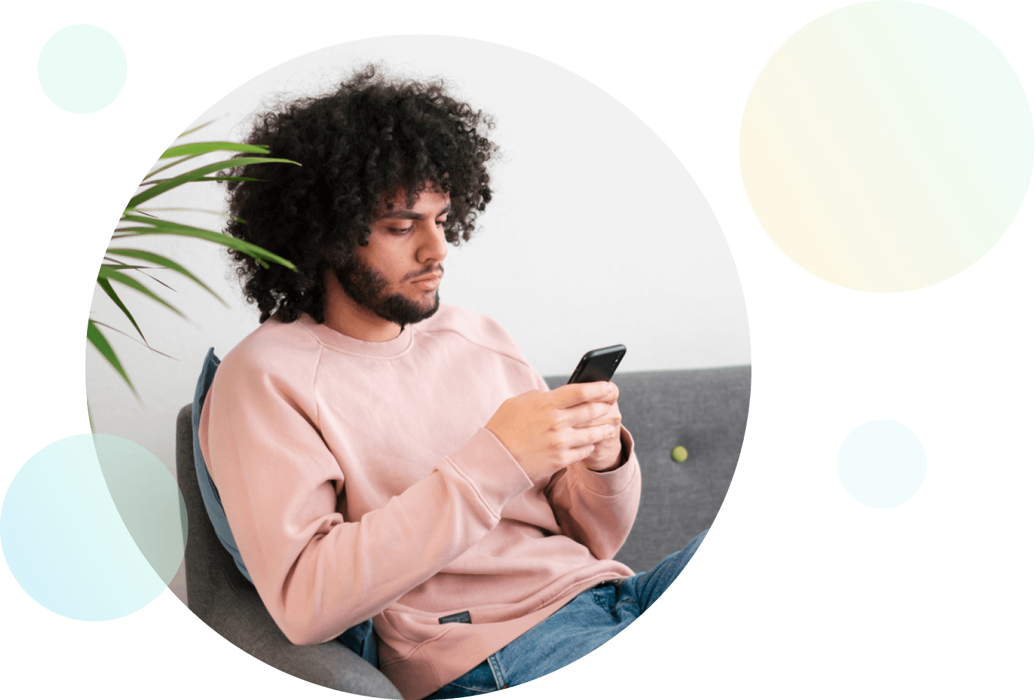 Man with pink shirt using smartphone