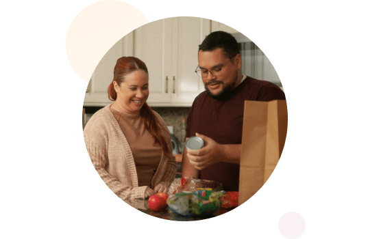 A man and a woman unpacking groceries